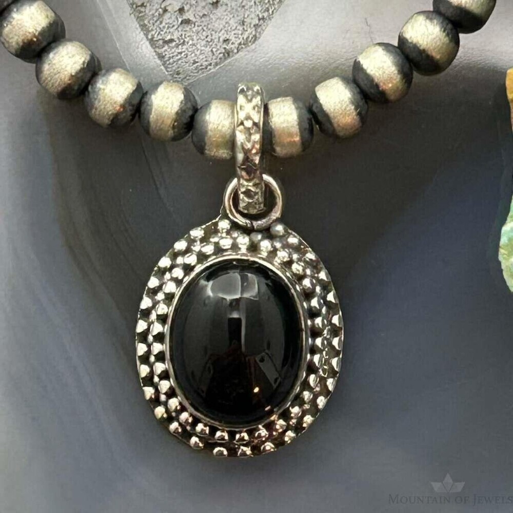 Sterling Southwestern Style Oval Onyx Decorated Charm/Pendant For Women